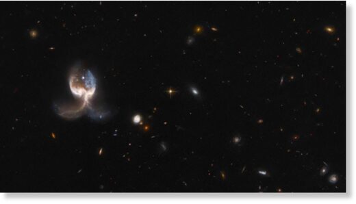Click to enlarge angel wing merging galaxies in the VV689 system