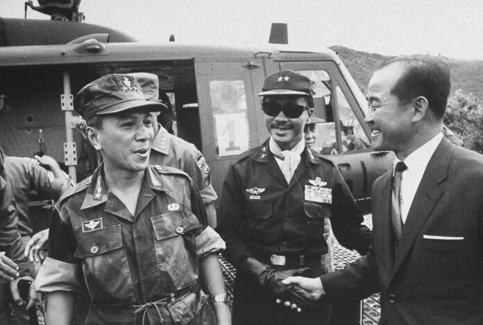 Nguyen Van Thieu, left, and Nguyen Cao Ky, center.