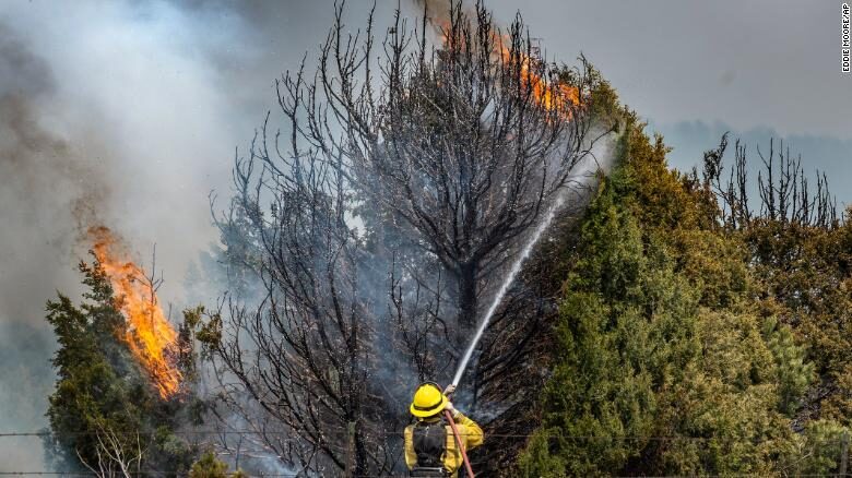 Firefighters on Thursday trying to hold the Calf Canyon/Hermit Peak Fire near Las Vegas, New Mexico.
