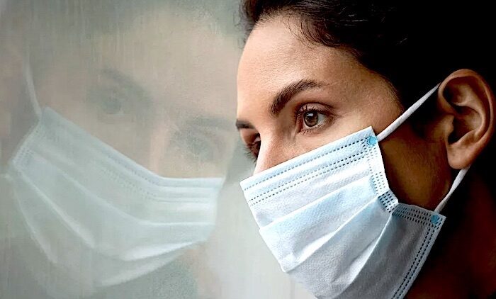masked woman reflection