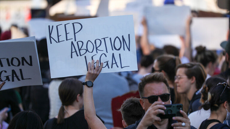 Click to enlarge Anti-abortion and abortion rights demonstrators