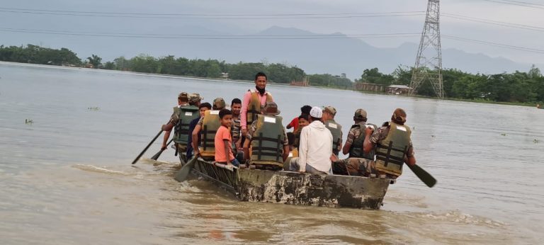 Troops from the Assam Rifles rescue flood victims