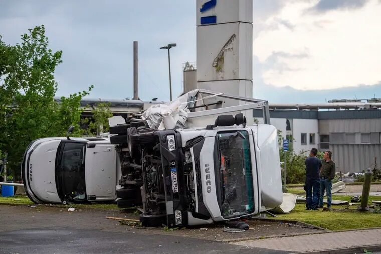 Two trucks overturned after a storm in Paderborn, Germany, Friday, May 20, 2022. A tornado swept through the western German city of Paderborn on Friday