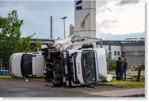 Two trucks overturned after a storm in Paderborn, Germany, Friday, May 20, 2022. A tornado swept through the western German city of Paderborn on Friday