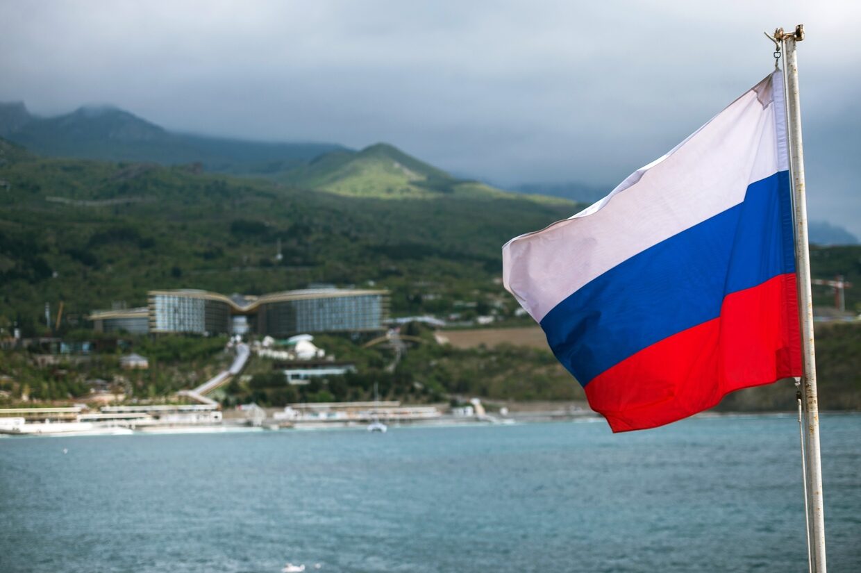 Click to enlarge Russian flag on the deck of Khersones sailboat in Crimea.