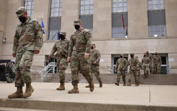 Click to enlarge National Guard troops leave Washington