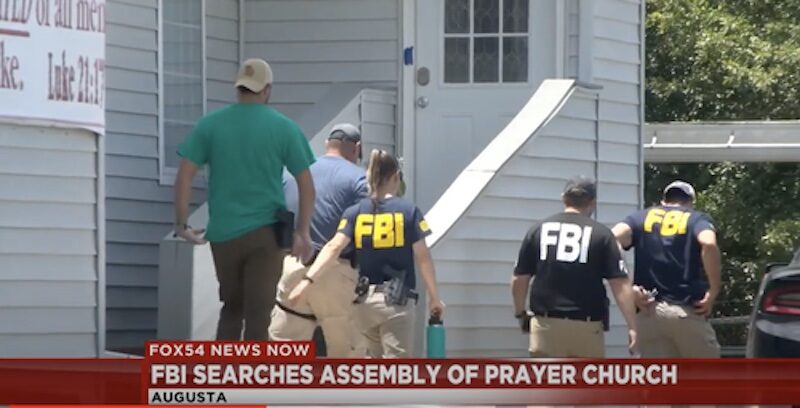 Click to enlarge Agents outside the Assembly of Prayer Church