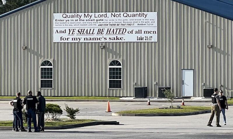 Click to enlarge Police outside the House of Prayer Church near Fort Stewart