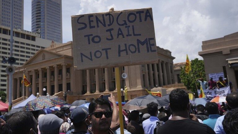 Sri Lankans attend a protest rally