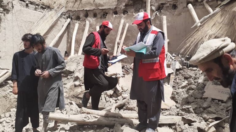 Afghan Red Crescent workers and volunteers surveying families affected by recent floods in Gardez, capital of Paktia province, July 2022.