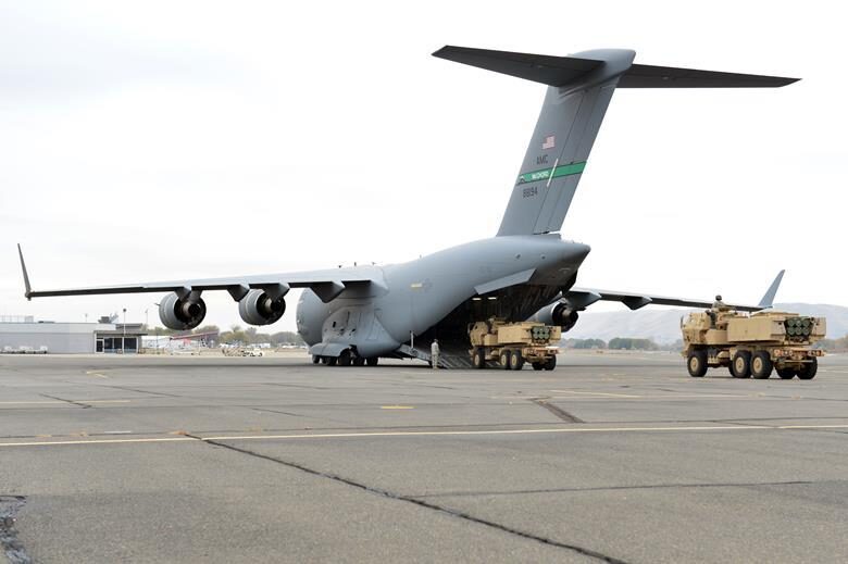 Click to enlarge HIMAR missile launcher loaded plane