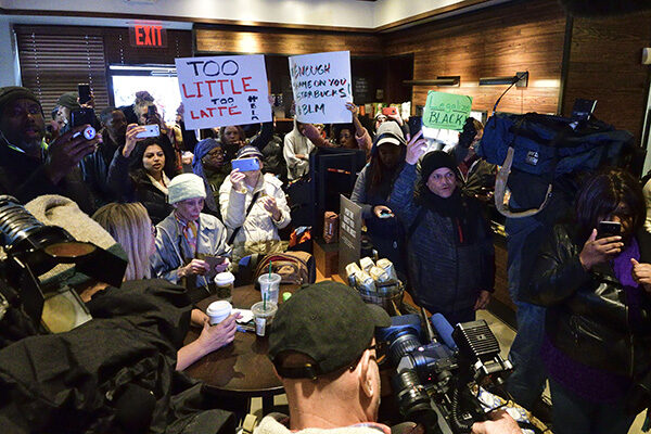 Protesters gather inside the Starbucks