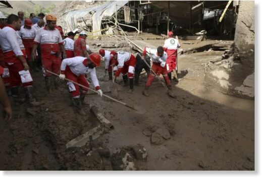 In Imamzadeh Davood village, north of Tehran, rescue workers dig through mud after flash flooding.