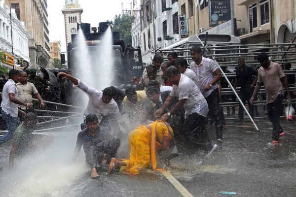 Police use water cannons to disperse farmers