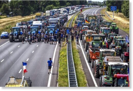 Farmers gather with their vehicles next to a Germany/Netherlands border