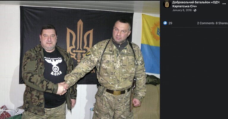 Carpathian Sich founder Oleg Kutsyn wears a t-shirt bearing a Nazi-style Reichsadler