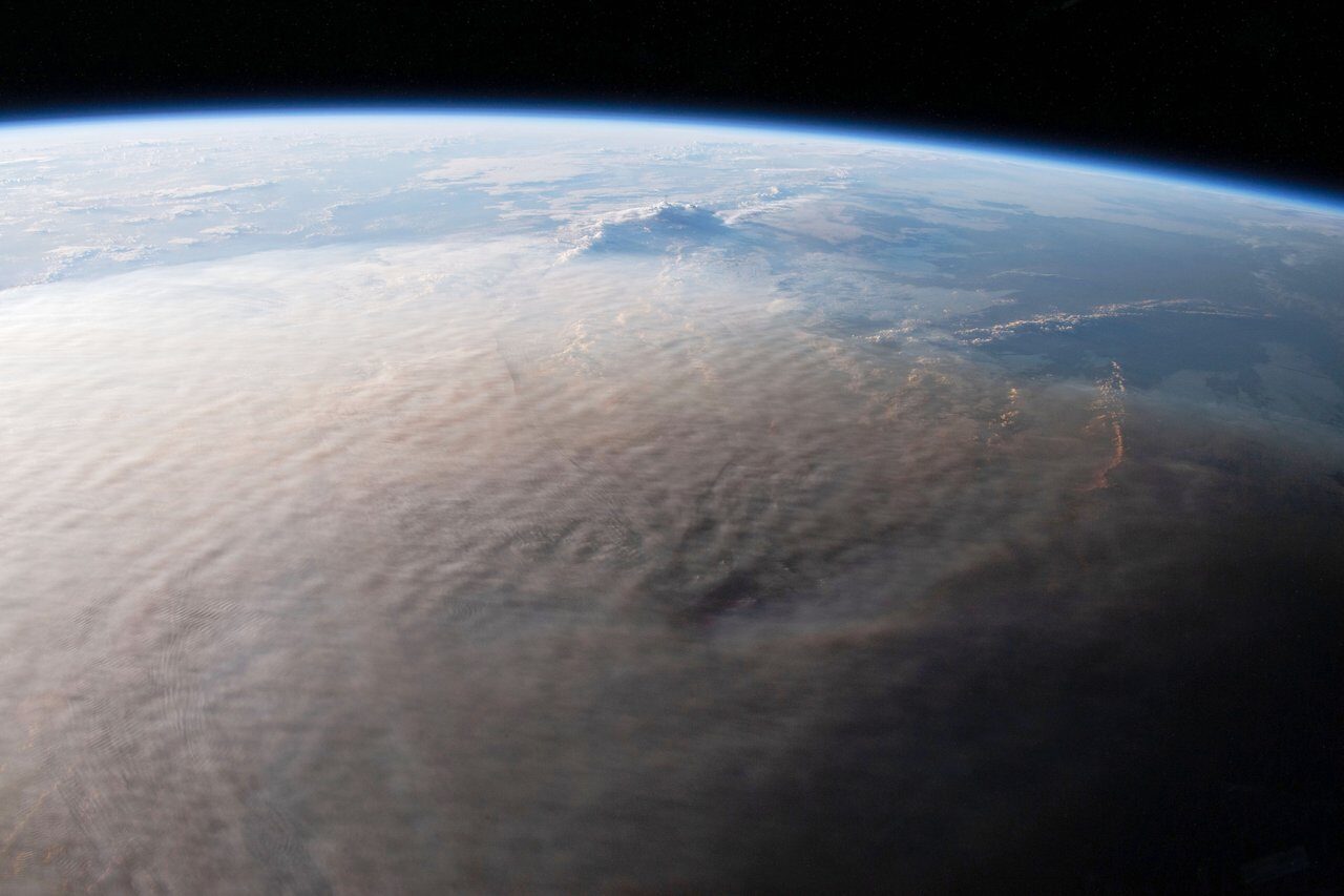 Click to enlarge tonga eruption ash plume space station