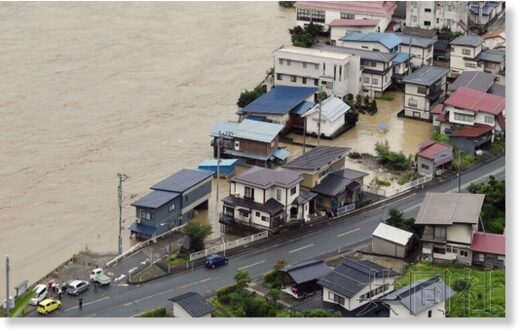 Houses are flooded in the town of Oe in Yamagata Prefecture on Thursday