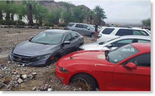 Cars are stuck in mud and debris from flash flooding at The Inn at Death Valley in Death Valley National Park.