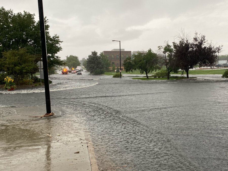 Rain flooded Spader Way near the Broomfield Library, temporarily closing the road, Tuesday, August 16, 2022.