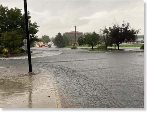 Rain flooded Spader Way near the Broomfield Library, temporarily closing the road, Tuesday, August 16, 2022.