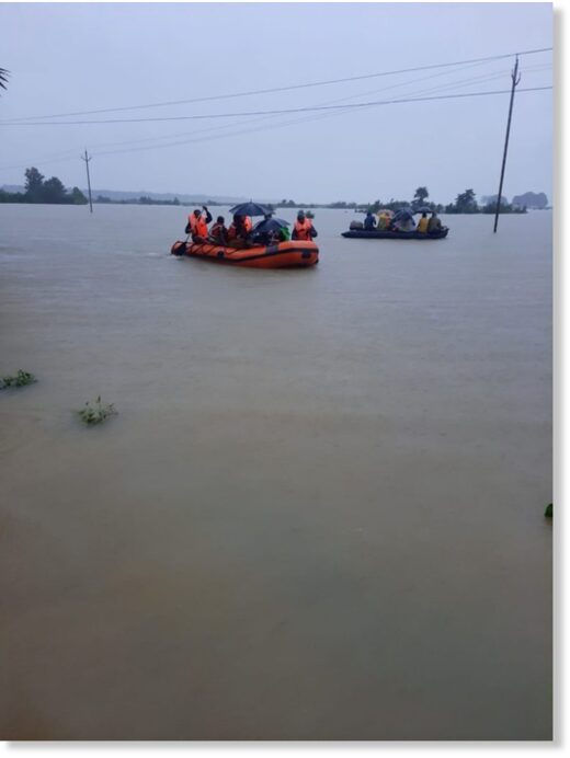 Click to enlarge Flood rescues in Athamallick area of Angul district