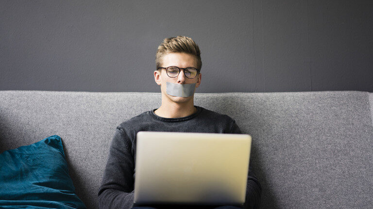 Click to enlarge censored speech taped mouth