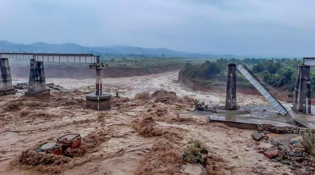A bridge on a Himachal-Punjab train route collapsed on Saturday as the Chakki river in Kangra district overflowed.