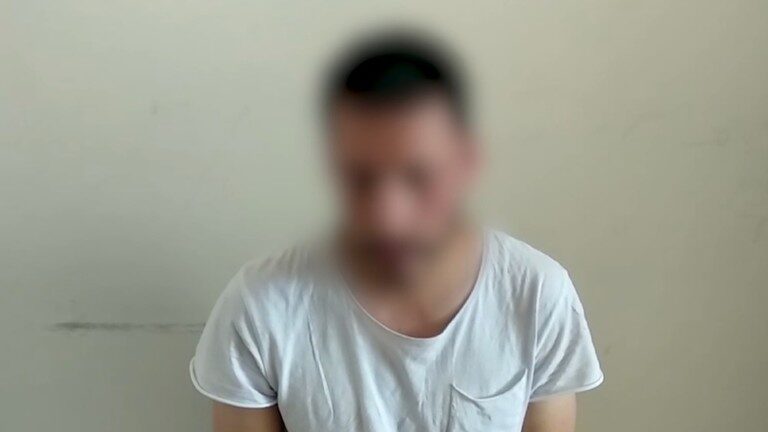 Click to enlarge Screenshot from a video showing the suspect.
