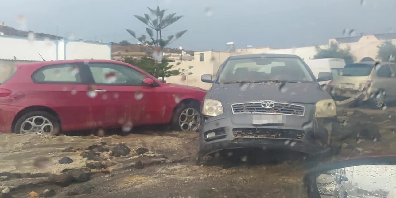 Click to enlarge Cars were swept away in Santorini.