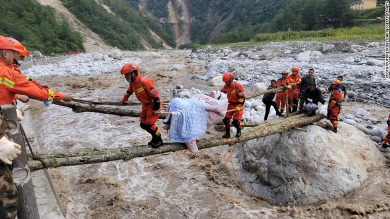 Rescuers transfer injured people in Luding county, Ganzi prefecture, Sichuan Province