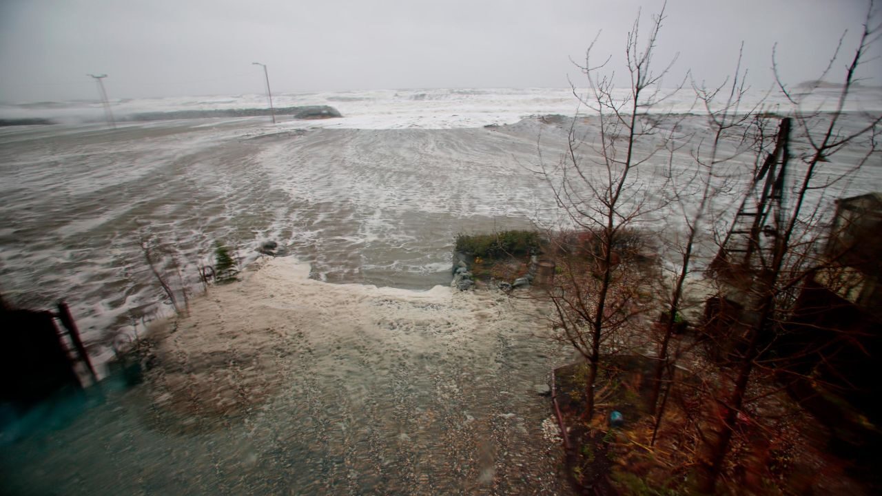 Click to enlarge Water from the Bering Sea, pushed by high winds, rushes into a home's backyard in Nome, Alaska, on Saturday, Sept. 17, 2022.