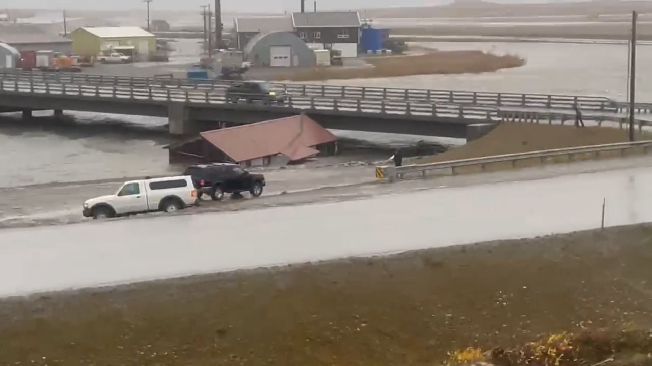 Click to enlarge A building that was swept away from its foundation crashes into a road overpass in Nome, Alaska on Saturday Sept. 17, 2022.
