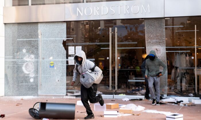 Thieves are seen looting stores