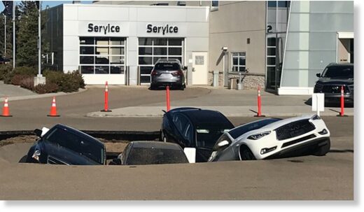 A number of vehicles were stuck at an Infiniti dealership in Edmonton on Tuesday, Sept. 20, 2022.