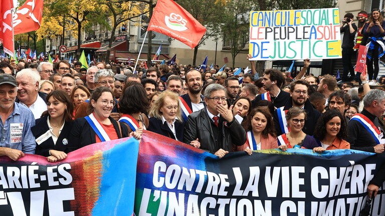 Jean-Luc Melenchon leads a protest march against the high cost of living in Paris