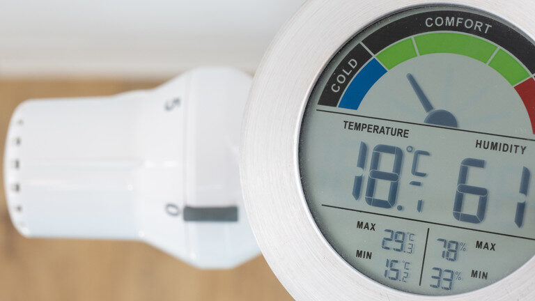 Click to enlarge A thermometer above a radiator.