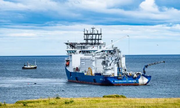 Click to enlarge ship laying subsea cable