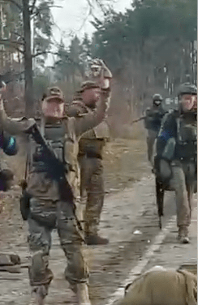 Ukrainian and Georgian Legion fighters celebrate after execute kill captive Russian soldiers