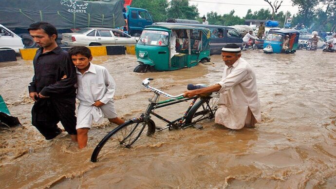 Click to enlarge Survivors in flood-hit Peshawar in Pakistan.