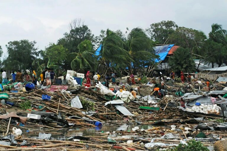 Residents search for their belongings amid the