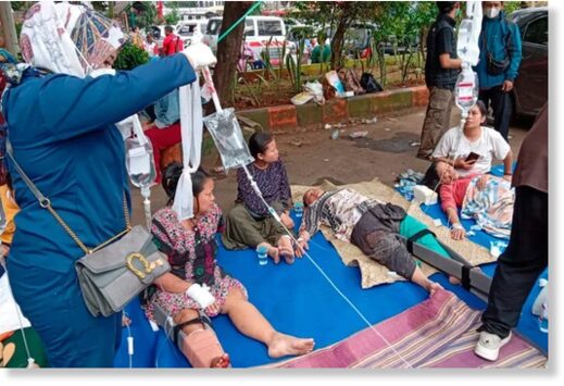 People injured during an earthquake receive medical treatment in a hospital parking lot in Cianjur, West Java, Indonesia (