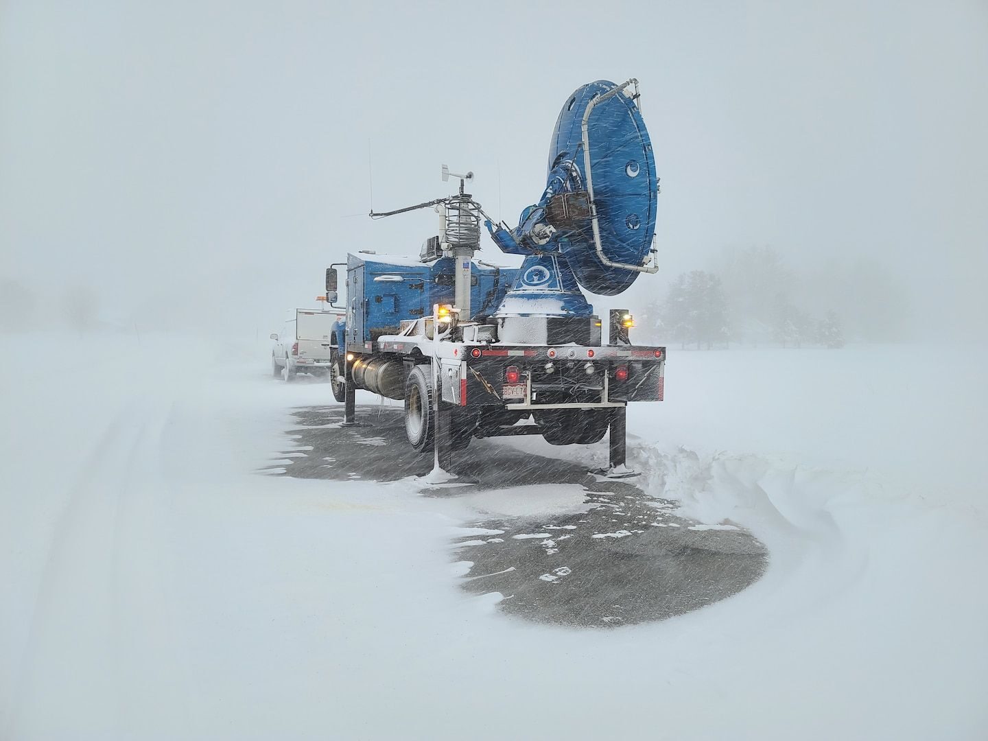 A mobile Doppler on Wheels unit is surrounded by intense snow from a lake-effect storm over the weekend.