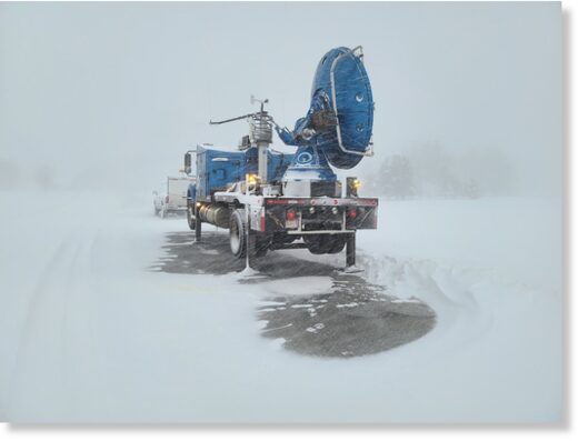 A mobile Doppler on Wheels unit is surrounded by intense snow from a lake-effect storm over the weekend.