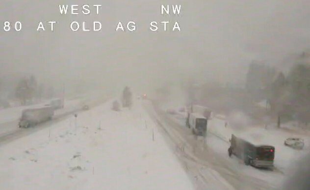 Click to enlarge Caltrans remote video traffic camera, traffic moves slowly through the snowy