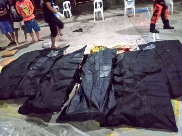 The dead bodies after flood swept a jeepney in Rizal province of the Philippines