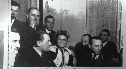 Chomiaks standing behind and to the left of Emil Gassner