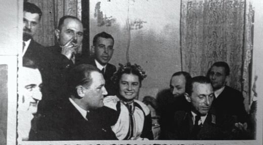 Click to enlarge Chomiaks standing behind and to the left of Emil Gassner