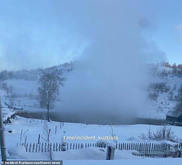Click to enlarge One house teeters right on the edge as it is almost swallowed up by the implosion