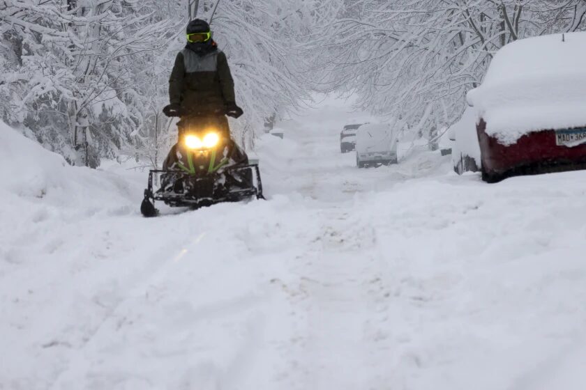 Click to enlarge A snowmobile charges up St. Paul Avenue on Wednesday in Duluth.